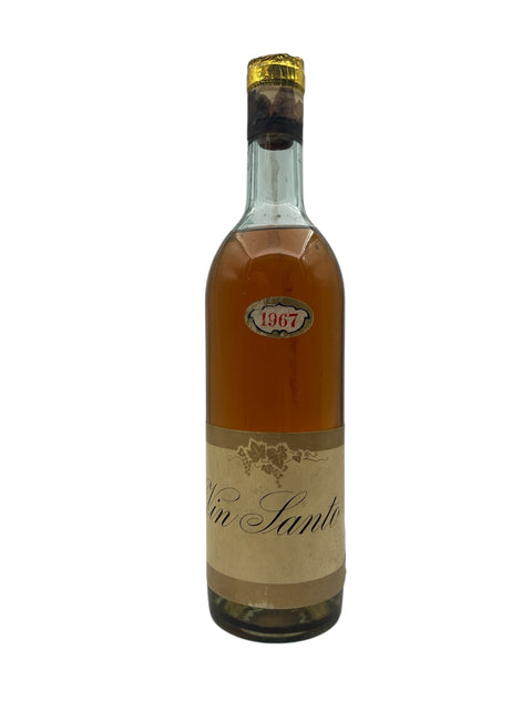 Flaska Vin Santo 1967 med gyllene färg och elegant etikett