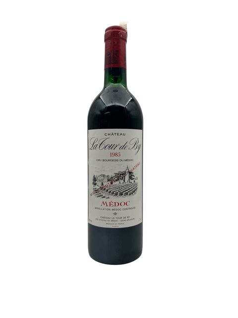 Flaska Château La Tour de By rött vin från 1985