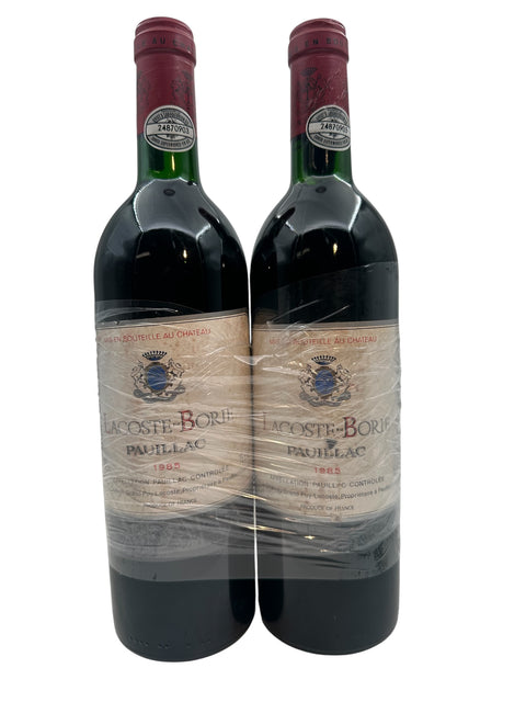Två flaskor Lacoste Borie Pauillac rött vin från 1985 från Bordeauxområdet
